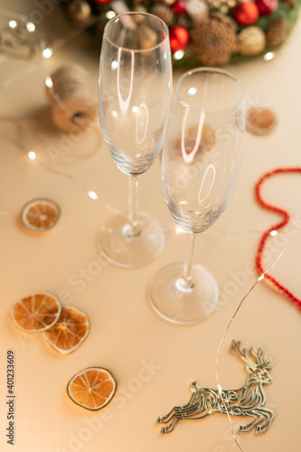 view of  empty champagne glass isolated on beige, Christmas mood