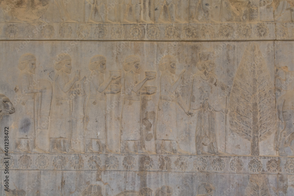 Bas relief on the wall of ruins in the Persepolis in Shiraz, Iran. The ceremonial capital of the Achaemenid Empire. UNESCO World Heritage