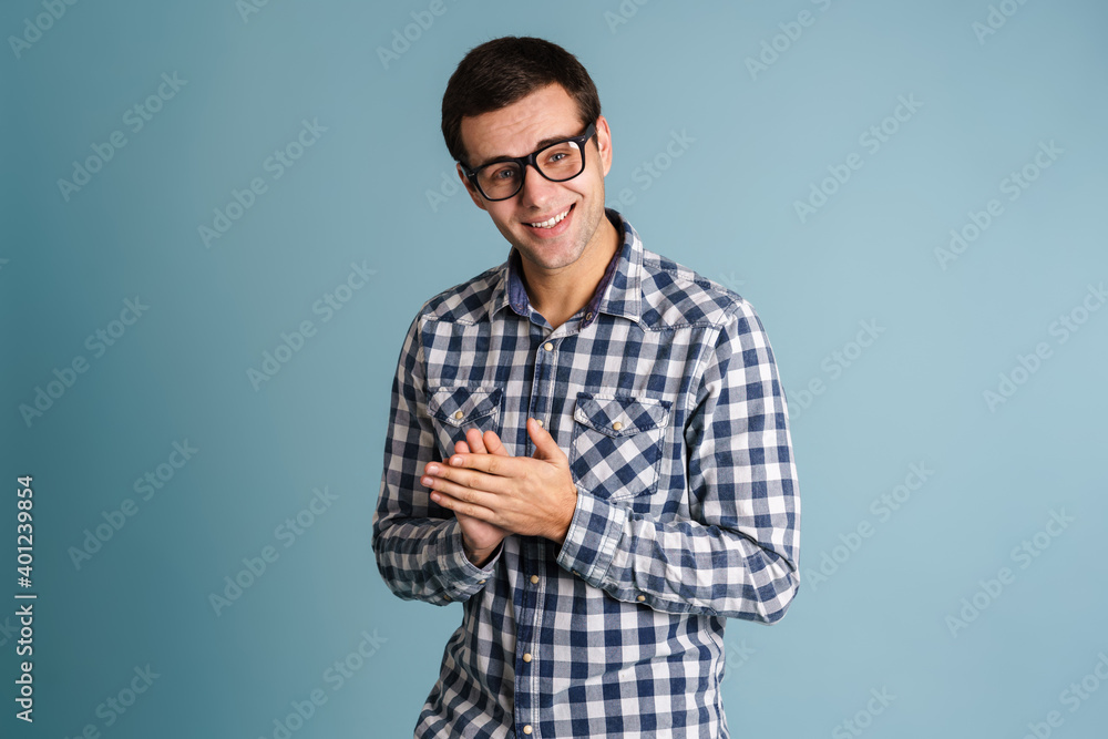 Portrait of happy smiling man isolated on blue Portrait of happy smiling man isolated on blue