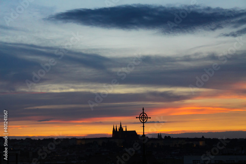 Colorful sunset over Prague with St Vitus cathedral silhouette