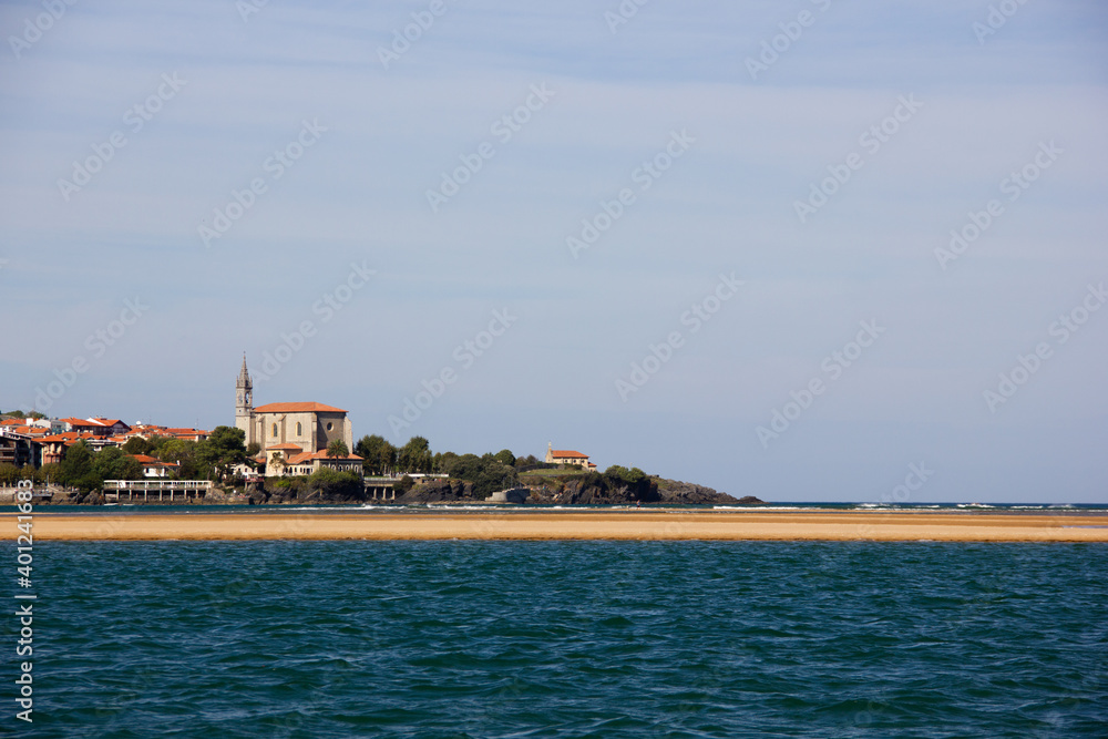 Mundaka church and coast town view from the river in the Basque Country. Natural landscape concept
