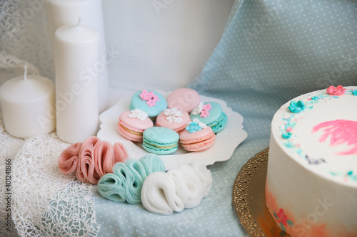 pink and turquoise macaroons and delicate jewelry made of chiffon.