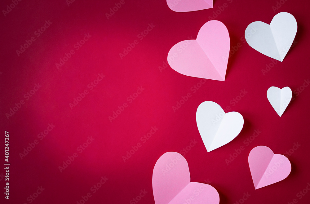 pink and white paper hearts on red background, paper art copy space for text