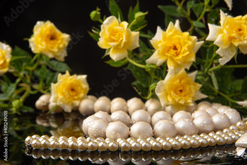 Wallpaper Mural Pearl necklace and bouquet of roses with dew on wet surface, selective focus. Torontodigital.ca