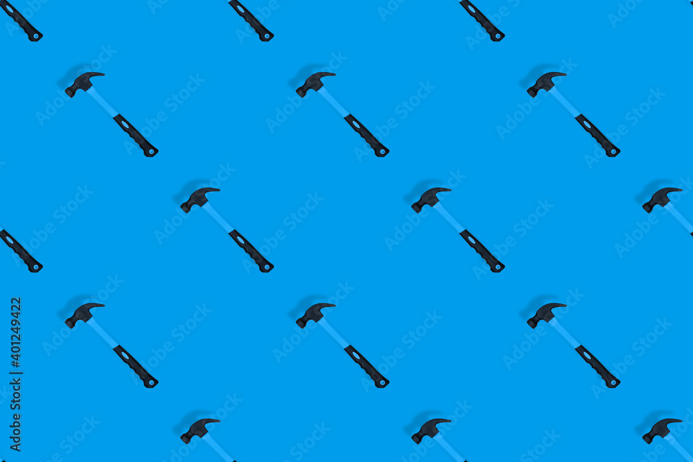 Hammer on a blue background. Hammer seamless pattern. Hammer on a blue background. Hammer seamless pattern.