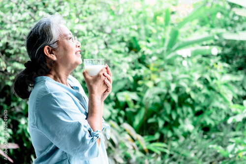 Asian retirement women are drinking milk for good health, To people and health concept.