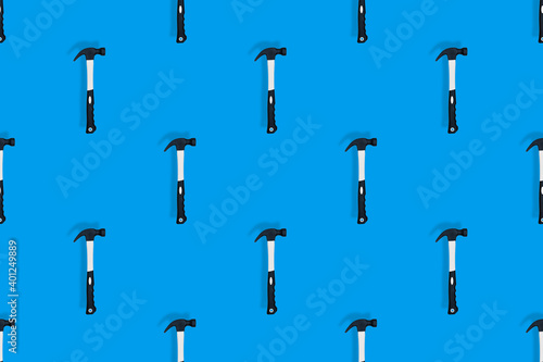 Hammer on a blue background. Hammer seamless pattern.