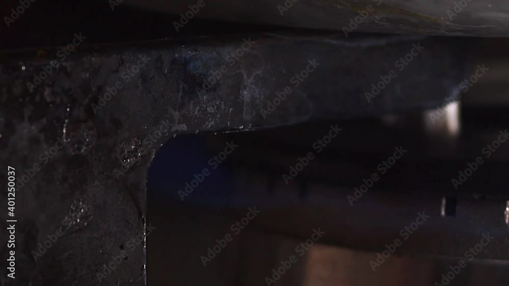 the flame of a blue gas fire in the burner stove in the kitchen in the apartment