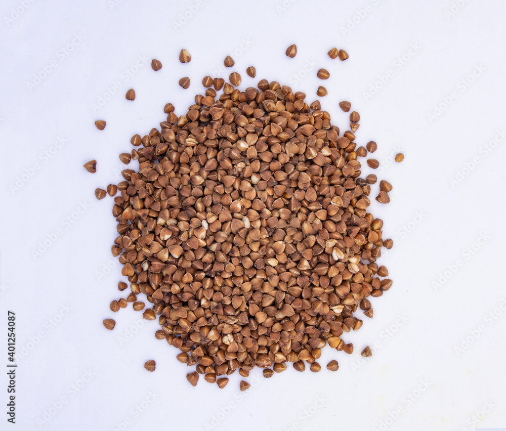 Brown buckwheat heap isolated on white background. Bio nutrition, natural food ingredient. Close up top view. Free space for copy
Brown buckwheat heap isolated on white background. Bio nutrition, natural food ingredient. Close up top view. Free space for copy