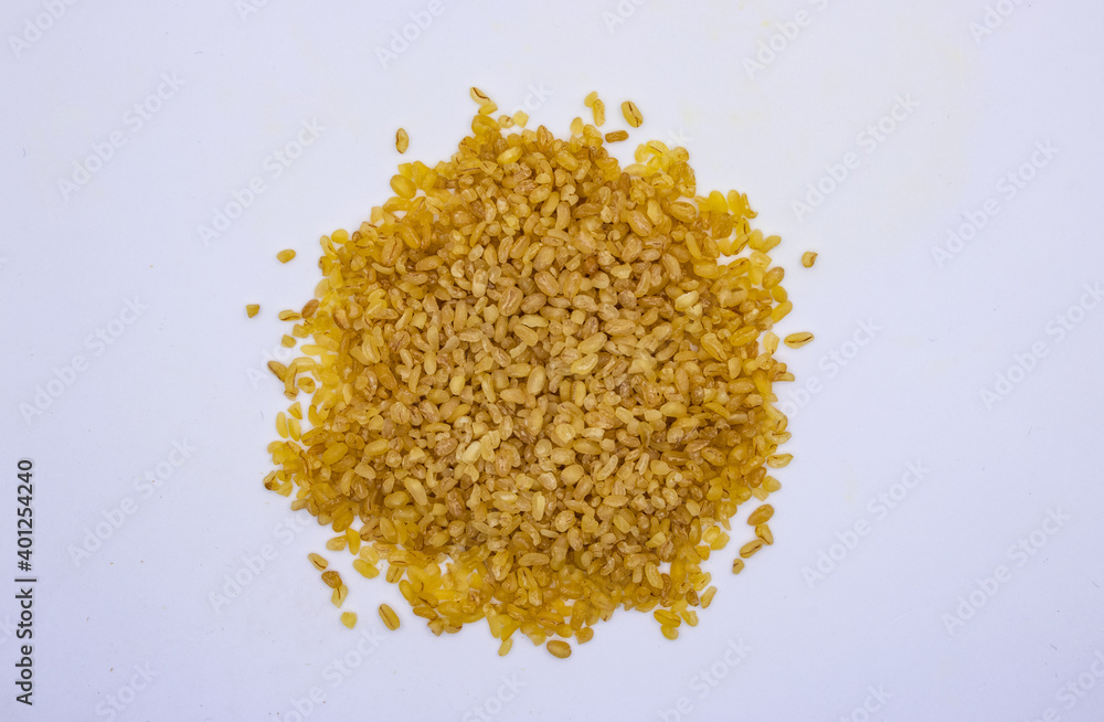 Yellow bulgur wheat heap isolated on white background. Bio nutrition, natural food ingredient. Close up top view
Yellow bulgur wheat heap isolated on white background. Bio nutrition, natural food ingredient. Close up top view