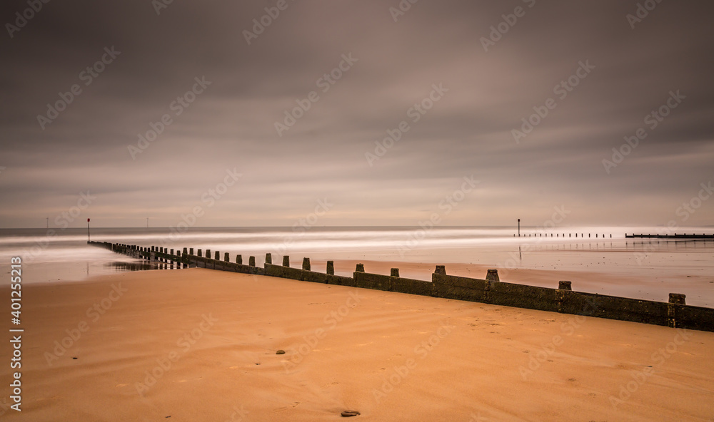 Fototapeta premium A stormy, cloudy and blustery day at Blyth beach in Northumberland, as the waves batter the coast