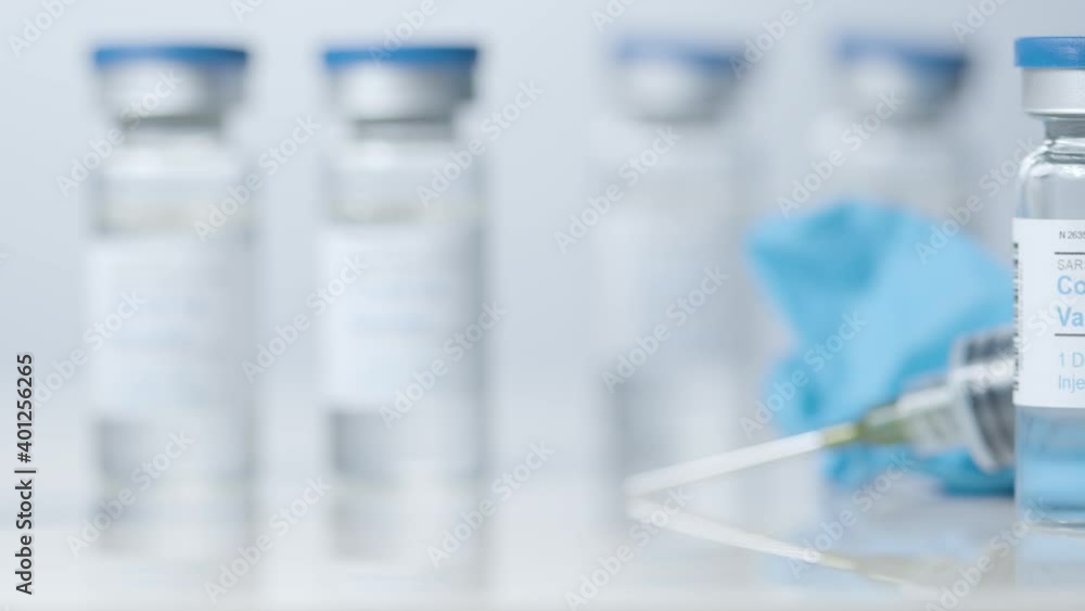 Sliding Close Up Shot of Five Vials of Covid 19 Vaccine Sliding Close Up Shot of Five Vials of Covid 19 Vaccine