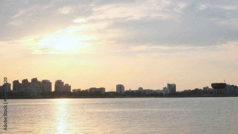 Silhouette of city with buildings and landmarks near river Silhouette of city with buildings and landmarks near river