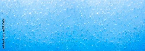 Blauer Unscharfer Hintergrund aus Eiskristallen