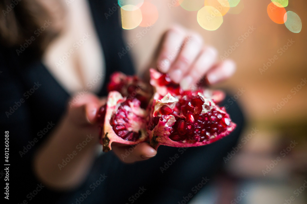 Pomegranate seeds in the hands Pomegranate seeds in the hands