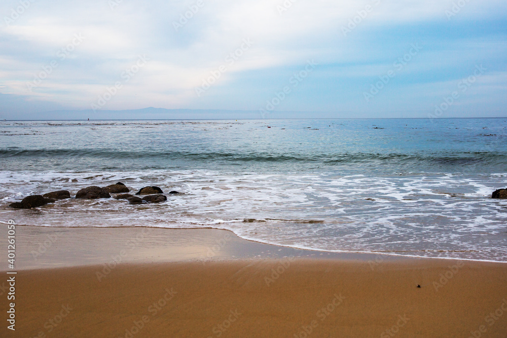 The Pacific Ocean coast in the city of Monterey in California. United States of America. Beautiful beach on a sunny day. Ocean landscape.