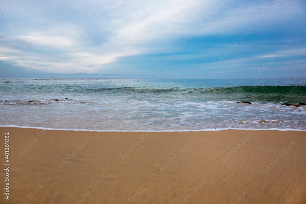 The Pacific Ocean coast in the city of Monterey in California. United States of America. Beautiful beach on a sunny day. Ocean landscape.