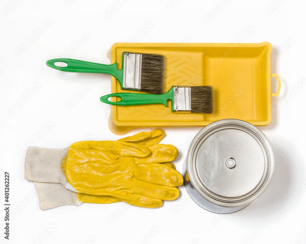 green brushes on the tray, with gloves and paint with copying space,flat lay green brushes on the tray, with gloves and paint with copying space,flat lay