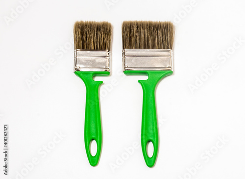 Wallpaper Mural two new green construction brushes big and small on a white background Torontodigital.ca