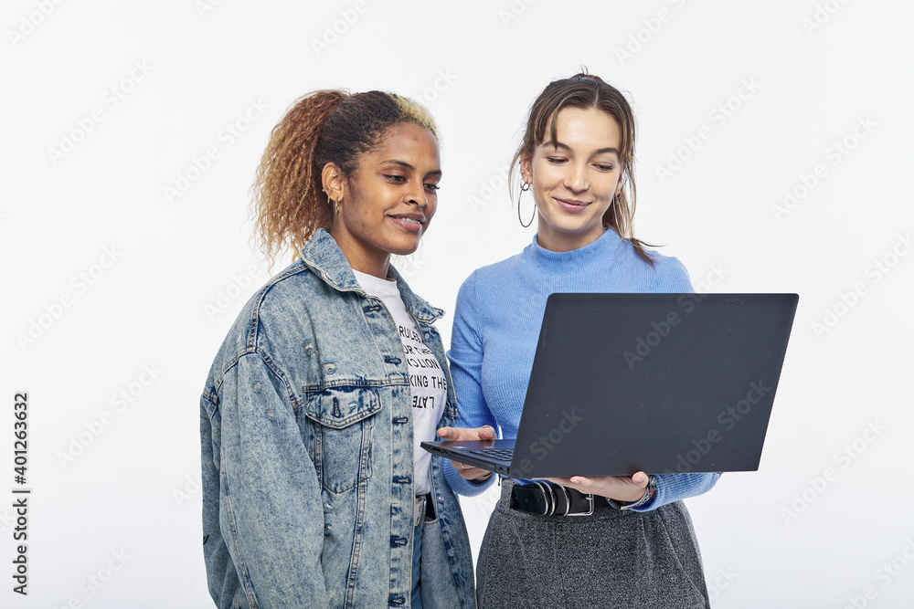 Couple of female college students, studying together and sharing, in times of COVID Couple of female college students, studying together and sharing, in times of COVID