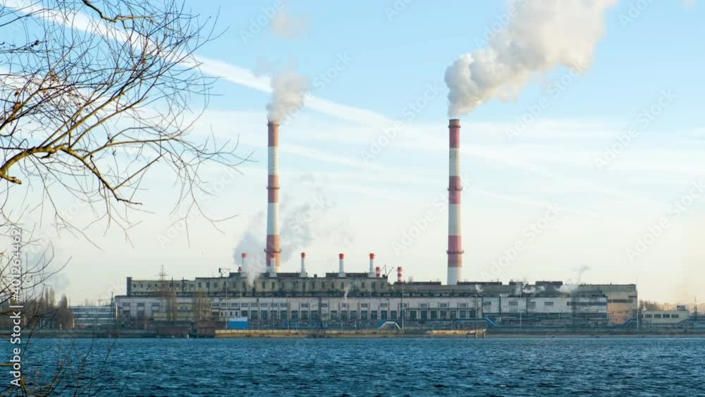 The hydroelectric power station operates and produces energy and electricity on the shore of a reservoir in the city The hydroelectric power station operates and produces energy and electricity on the shore of a reservoir in the city