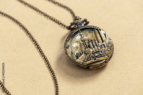 Vintage Antique pocket watch old fashion with brown background, Sensitive Focus