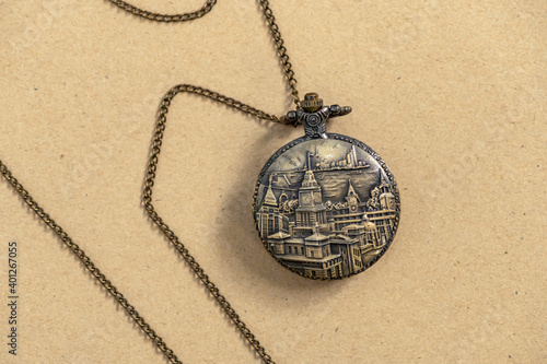 Vintage Antique pocket watch old fashion with brown background, Sensitive Focus