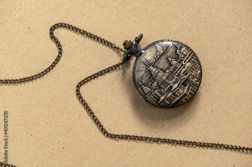 Vintage Antique pocket watch old fashion with brown background, Sensitive Focus