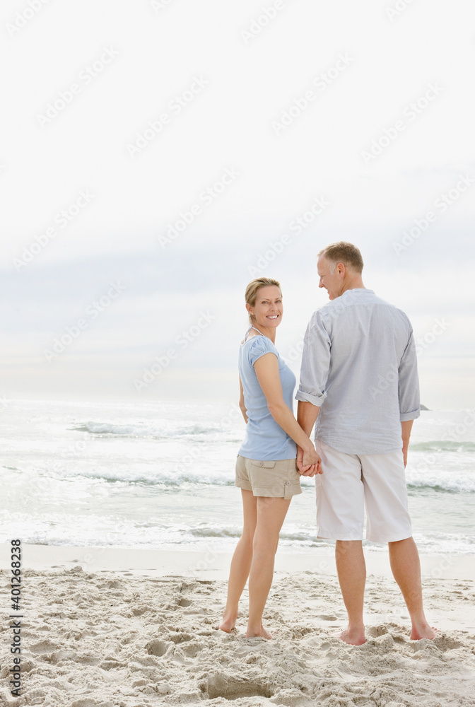 Portrait of couple standing on beach Portrait of couple standing on beach