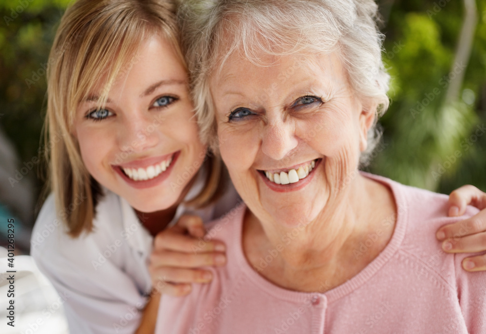 Daughter with mother looking at camera and smiling Daughter with mother looking at camera and smiling