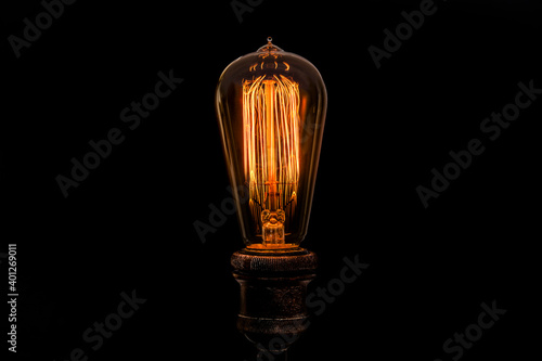 Edison light bulb on black background