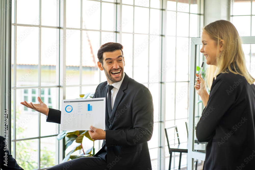 Caucasian and mixed race business man and woman wearing formal suit in the office Caucasian and mixed race business man and woman wearing formal suit in the office