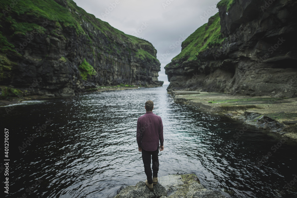 Denmark, Faroe Islands, Gjgv, Man standing in gorge Denmark, Faroe Islands, Gjgv, Man standing in gorge