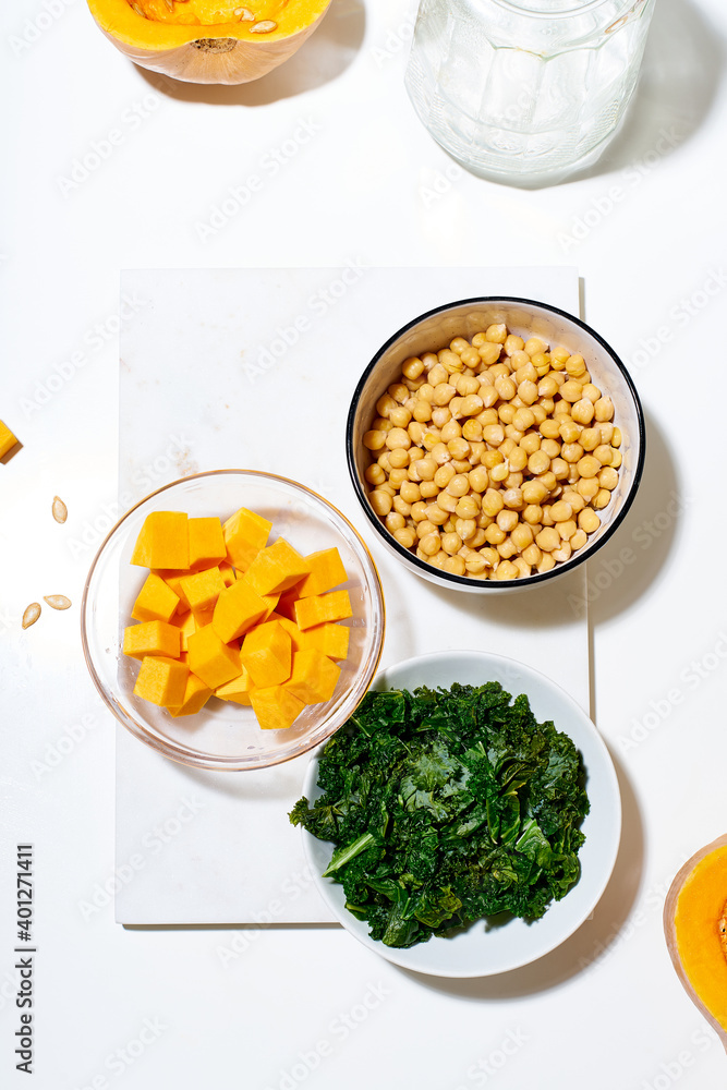 Cooking a salad with lemon, chickpeas and kale
