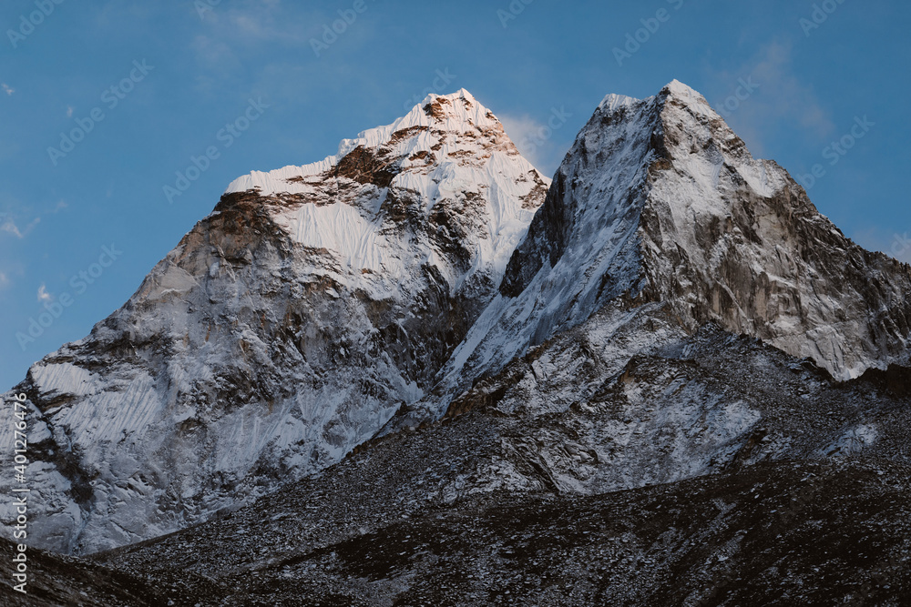 Majestic scenery of desert rough rocky mountainous terrain under blue sky in sunny day