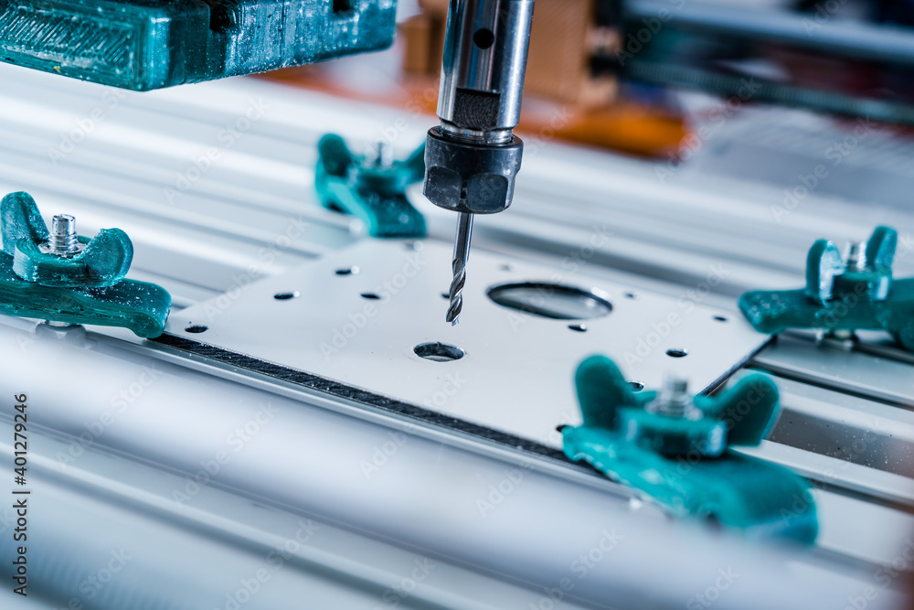 CNC milling machine cutting aluminium part. CNC milling machine cutting aluminium part.