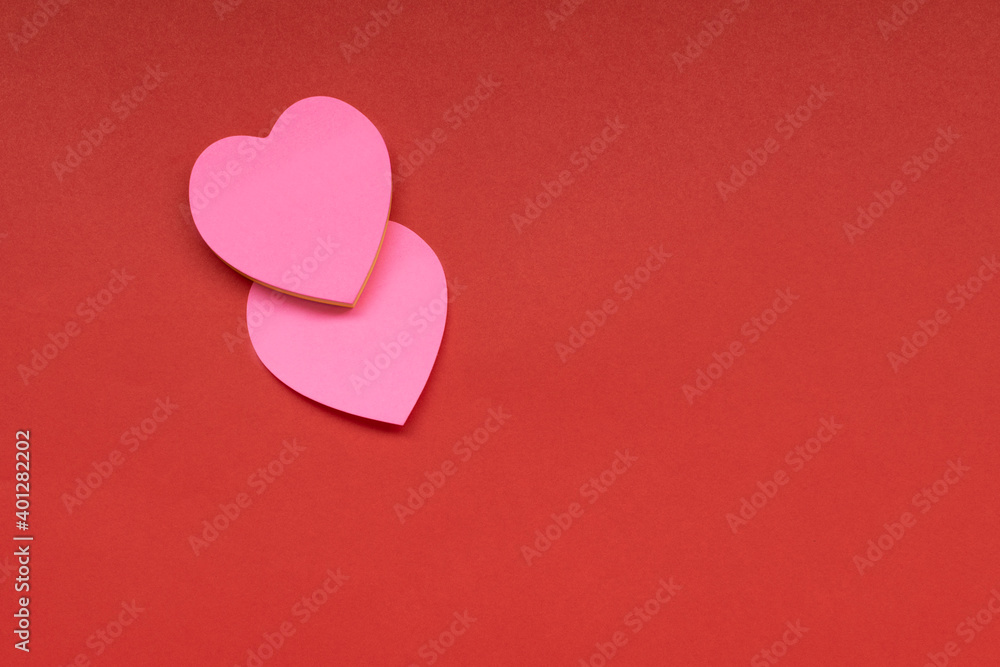 Two hearts on the red background. Valentine's Day