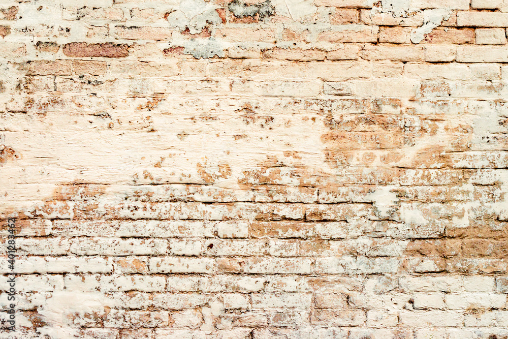 Texture of a brick wall with cracks and scratches which can be used as a background Texture of a brick wall with cracks and scratches which can be used as a background