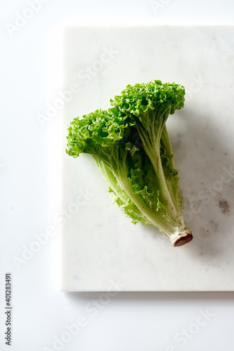 Lollo bionda lettuce on white background photo