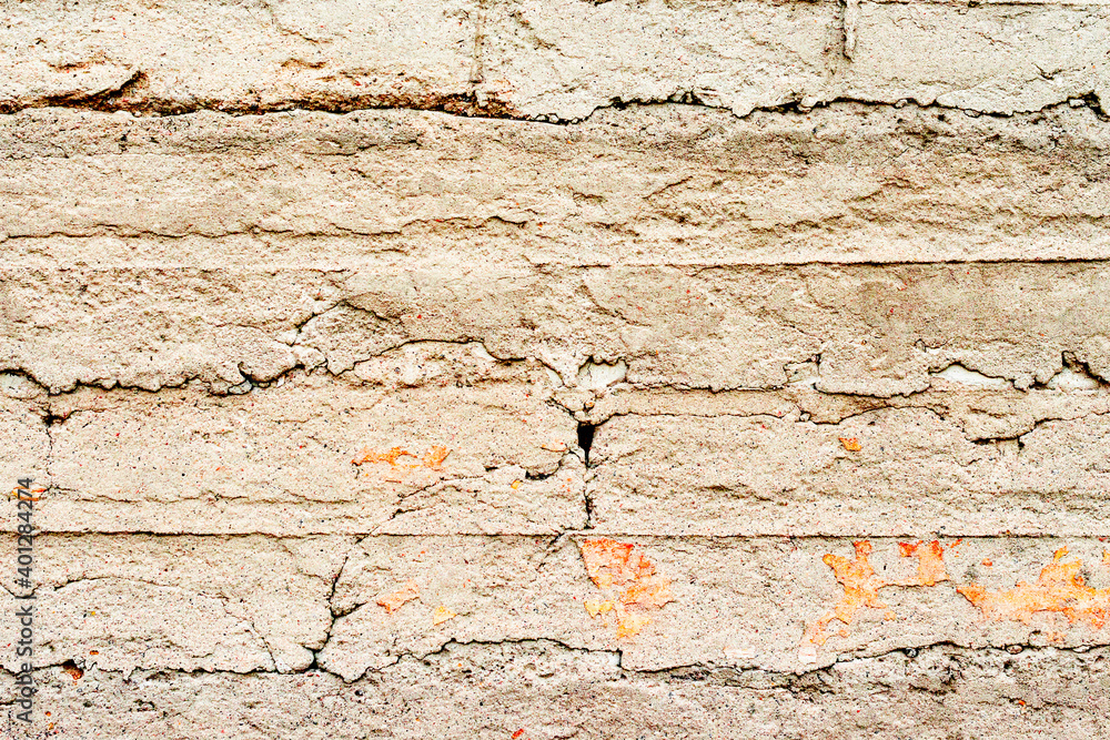 Texture of a concrete wall with cracks and scratches which can be used as a background Texture of a concrete wall with cracks and scratches which can be used as a background