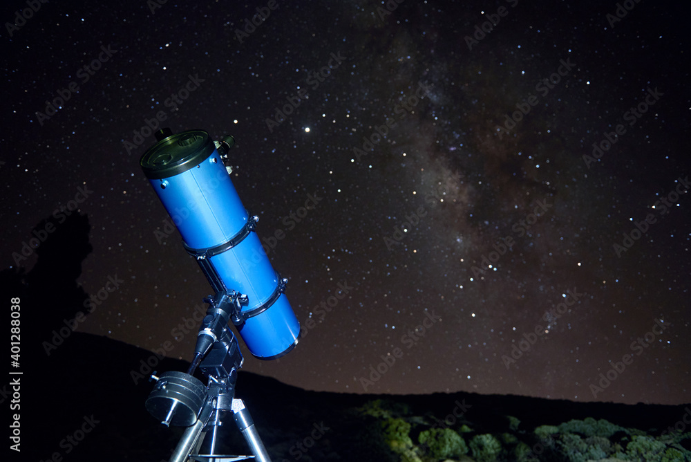 From below of modern optical telescope against cloudless dark sky with glowing stars at night time From below of modern optical telescope against cloudless dark sky with glowing stars at night time