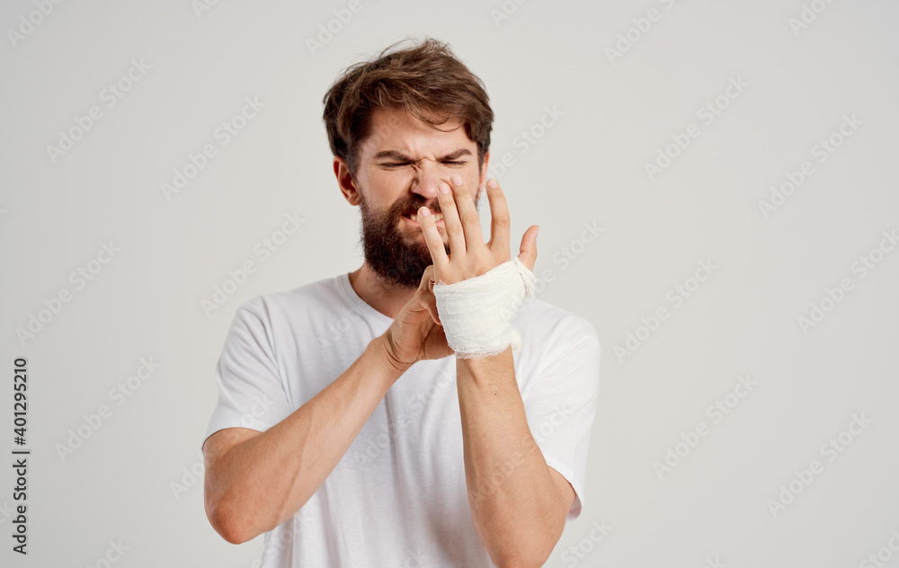 bearded man on patient bandaged hand health problems hospital medicine bearded man on patient bandaged hand health problems hospital medicine