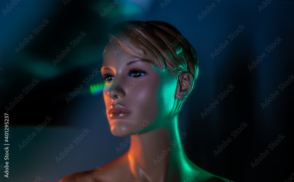 Creative image of mannequin woman in dark room with light effects