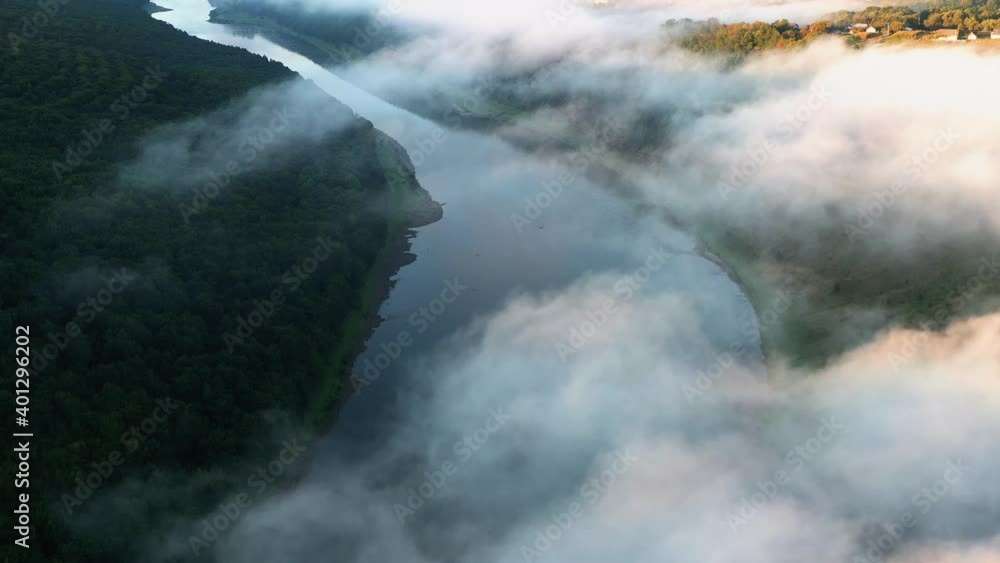 Flight through majestic foggy river Dnestr and lush green forest at sunrise time. Dniester canyon, Ukraine, Europe. Aerial UHD 4k drone video Flight through majestic foggy river Dnestr and lush green forest at sunrise time. Dniester canyon, Ukraine, Europe. Aerial UHD 4k drone video