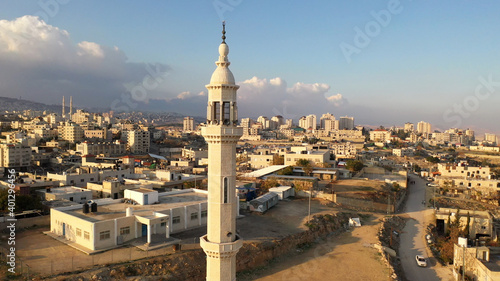 Tableau sur toile Mosque Tower Minaret in Palestine town, Aerial view
al-eizariya Town mosque mina