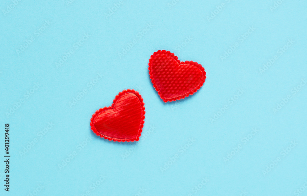 Two hearts close-up on a blue background, valentines, horizontal orientation
