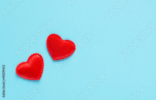 Two hearts close-up on a blue background  valentines  horizontal orientation  copy space