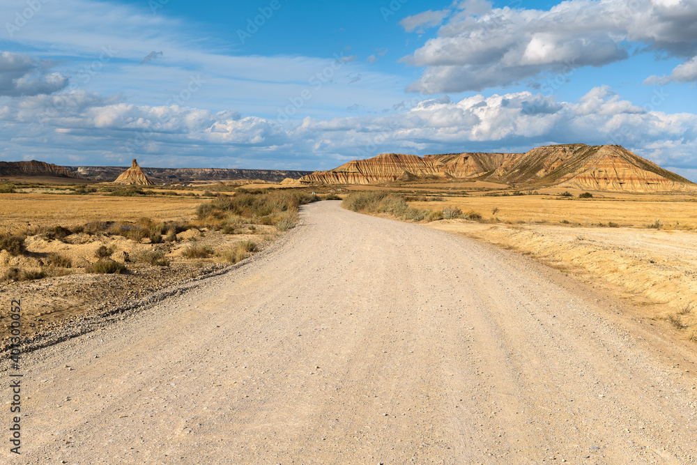 Fototapeta premium Gravel road in Bardenas Reales, Navarre, Spain 