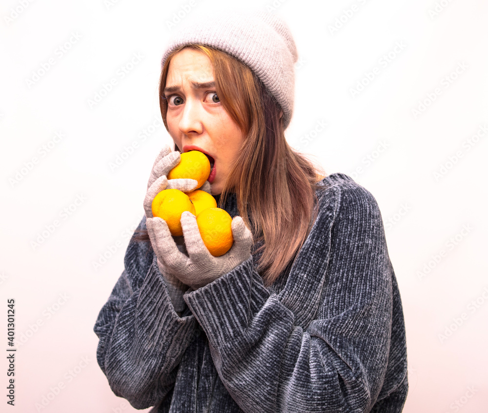 Girl in grey clothes with tangerines in hands isolated on white background
Girl in grey clothes with tangerines in hands isolated on white background
