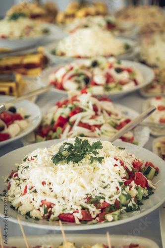 Catering food table set decoration. Table with all kinds of delicious food at party.